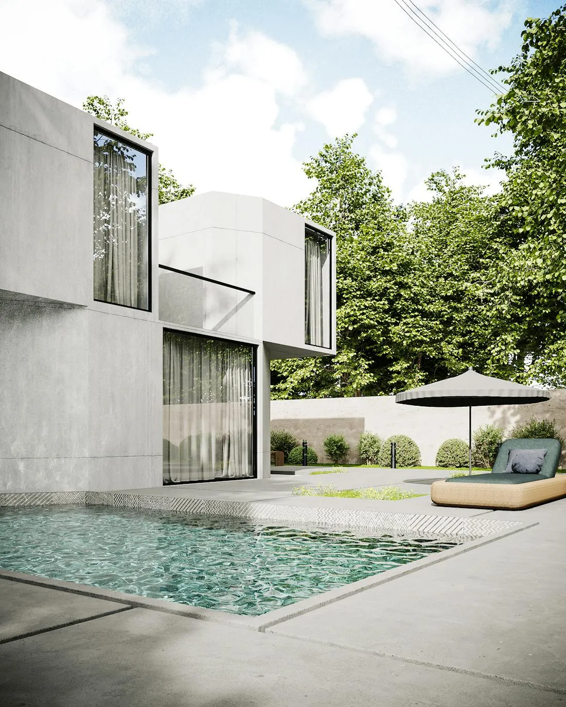 Concrete pool surround in a landscaped Brighton backyard